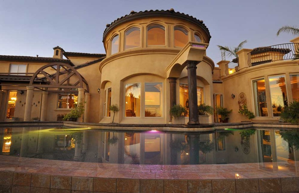 Curved rear elevation overlooking the pool